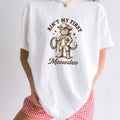 White comfort colors 1717 t-shirt with a cat in a cowboy hat graphic and text on a white background