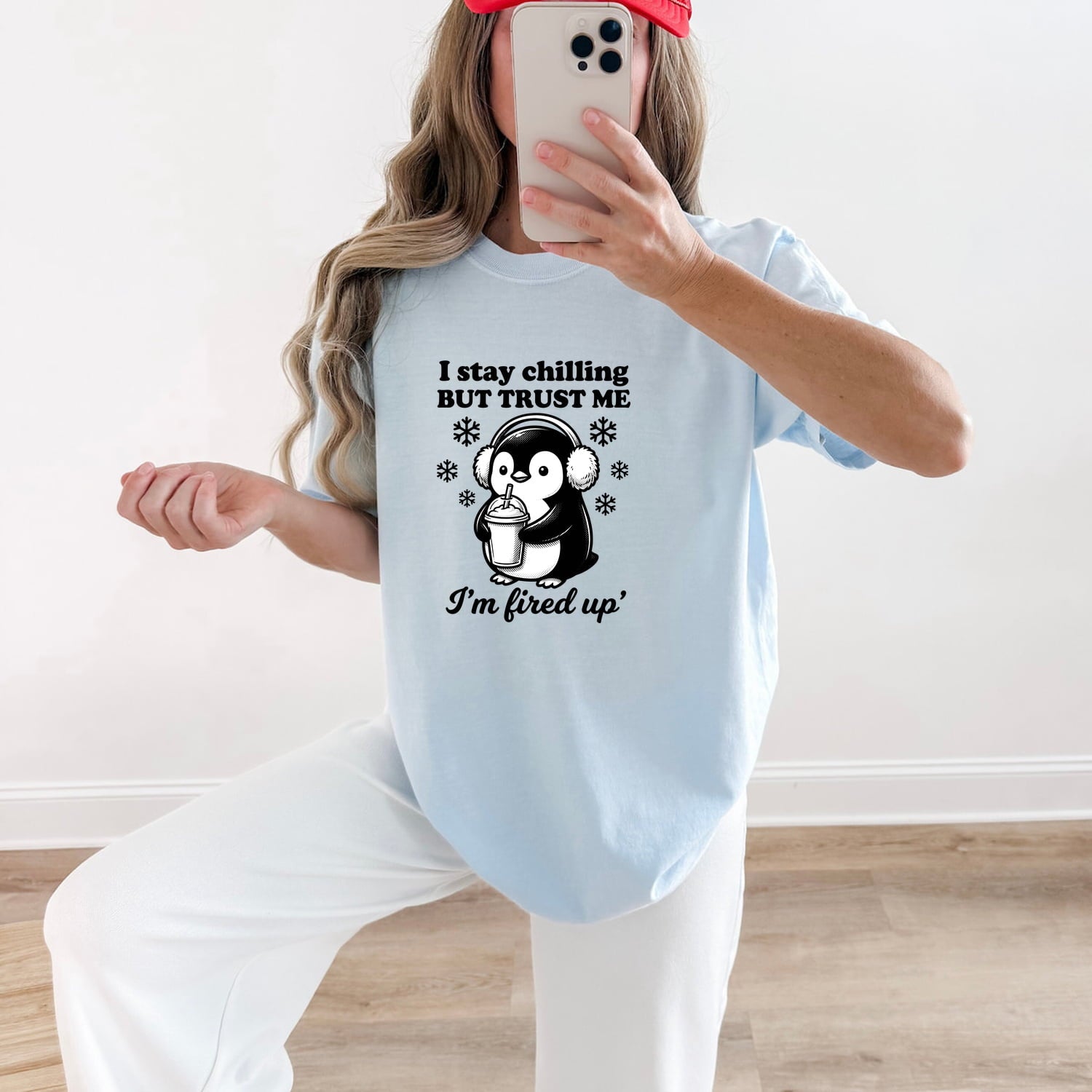 Woman wearing a chambray Comfort Colors 1717 t-shirt with a penguin graphic and funny text, taking a mirror selfie
